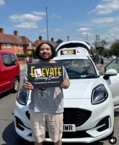 Successful student passed manual driving test with an intensive driving course instructor