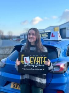 Local driving lessons success story: smiling student with their L-plate.